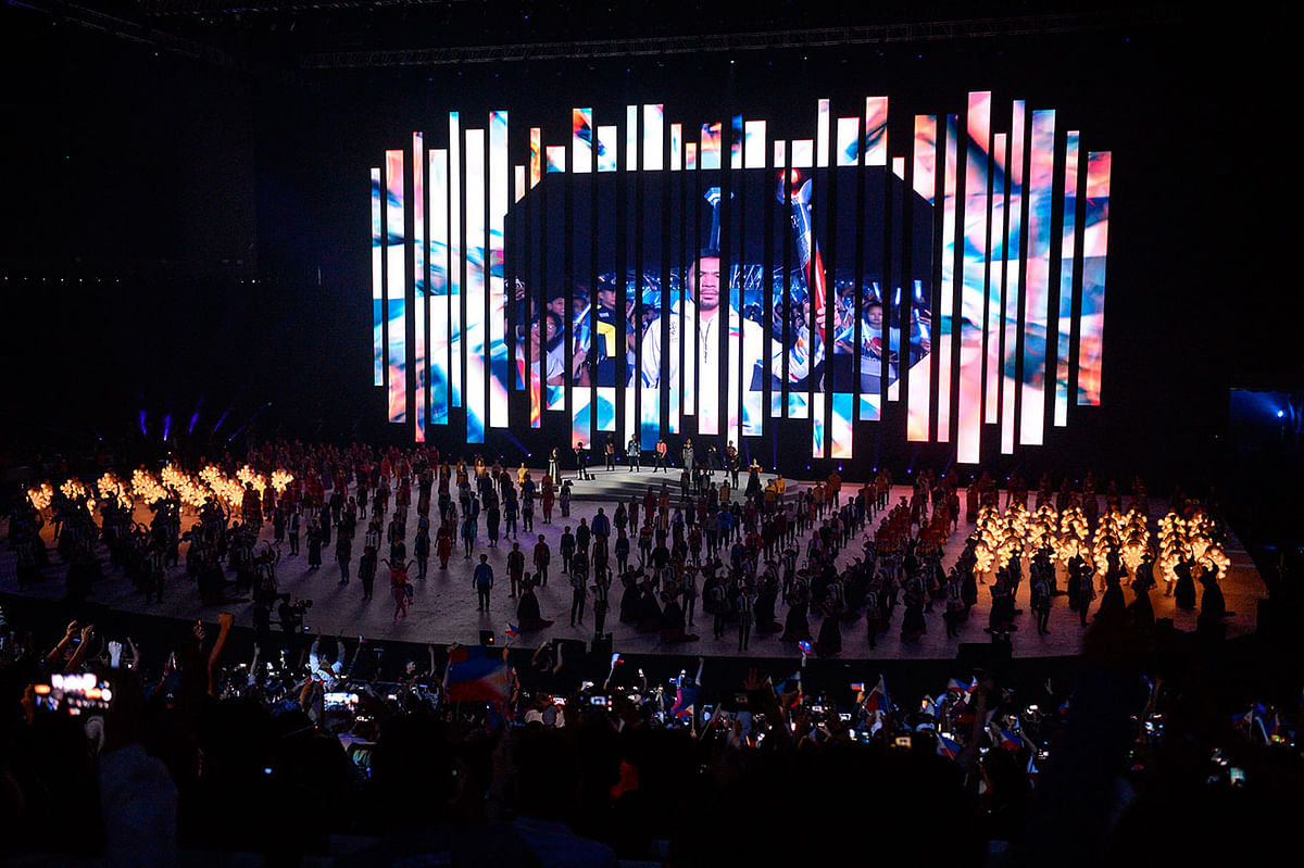 Philippines` boxing champion Manny Pacquiao is seen on a pre-recorded video as he leads the lighting of the cauldron shown during the opening ceremony of the SEA Games (Southeast Asian Games) at the Philippine Arena in Bocaue, Bulacan province, north of Manila on 30 November 2019. Photo: AFP
