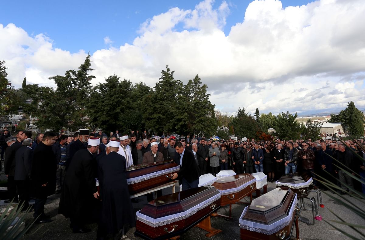 Relatives and family attend the funeral of eight Lala family members who died during the earthquake in Durres, on 30 November 2019. Photo: AFP