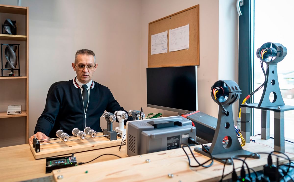 Company founder and chief inventor of Polish firm Spartaqs Slawomir Huczala sits next to are lasers items for a drone shield system at his company`s headquarters of the firm in Mikolow, southern Poland, on 20 November 2019. The Aerostatic Rocket Launcher (ARL) dronecan send a rocket 90 kilometres above the earth`s surface, or high enough to place a nanosatellite in orbit, according to Huczala. Photo: AFP