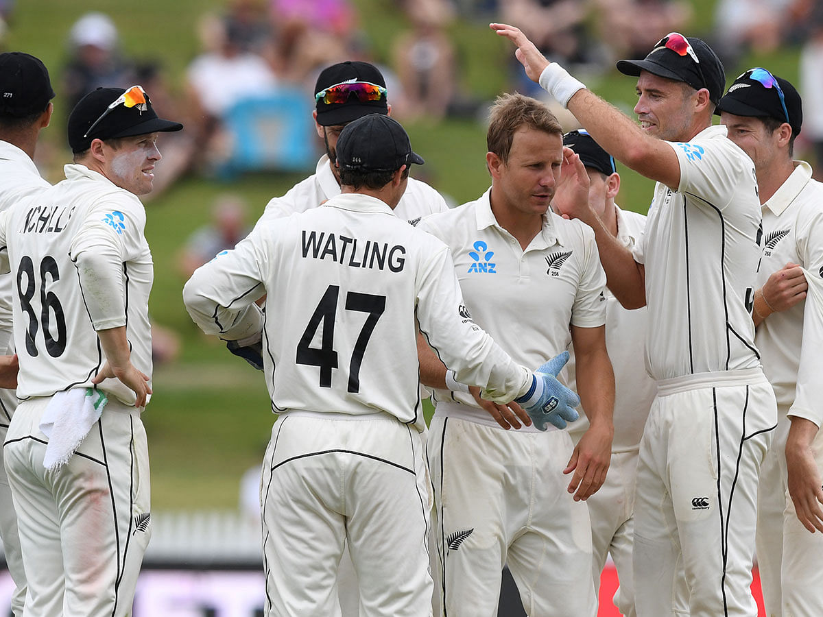 New Zealand`s Neil Wagner celebrates the wicket of England`s Zack Crawley with teammates in the Second Test against England at Seddon Park, Hamilton, New Zealand on 1 December 2019. Photo: Reuters