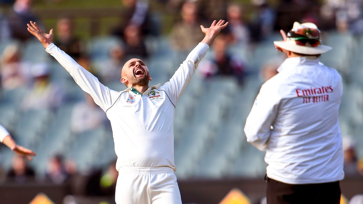 Australia`s spinner Nathan Lyon (C) reacts after appealing successfully for an LBW decision against Pakistan`s batsman Yasir Shah on the fourth day of the second Test cricket match in Adelaide on 2 December, 2019. Photo: AFP