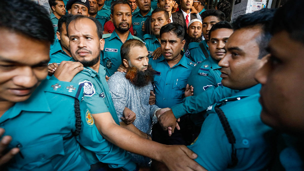 Police cordon Masum Billah, a bus driver sentenced to life in prison for the death of two students killed in a bus accident in Dhaka, at Metropolitan Session`s Judge Court in Dhaka on 1 December, 2019. Photo: Dipu Malakar