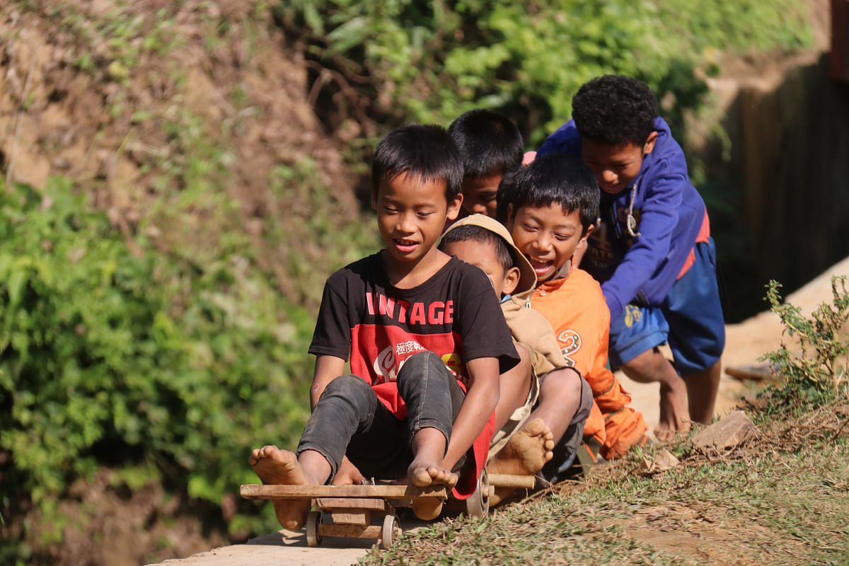 Children playing with cart at Tripurapara, Khagrachhari on 27 November 2019. Photo: Nerob Chowdhury