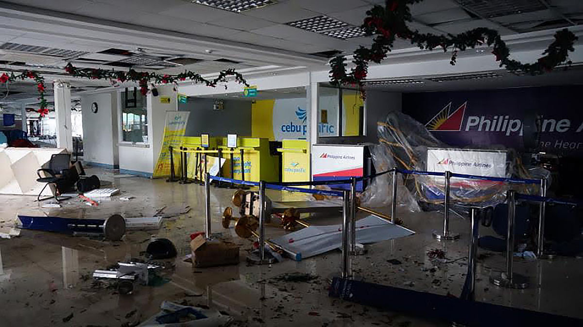 Debris litter inside the passenger terminal, after one of its walls was destroyed in Legaspi City, Albay province, south of Manila on 3 December 2019, after Typhoon Kamurri battered the province. Photo: AFP
