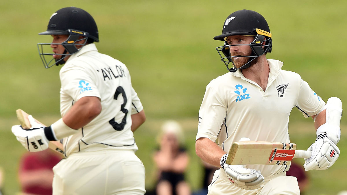 New Zealand`s batsmen Kane Williamson (R) and Ross Taylor run between the wickets during the fifth day of the second cricket Test match between England and New Zealand at Seddon Park in Hamilton on Tuesday. Photo: AFP