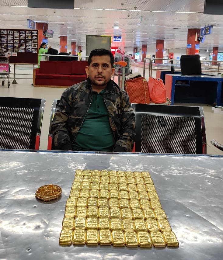 Himel Khan with gold bars. Photo: Courtesy