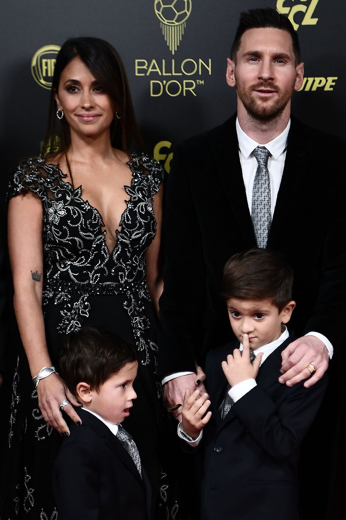 Barcelona`s Argentinian forward Lionel Messi (R) and his wife Antonella Roccuzzo (L) and their sons Thiago and Mateo arrive to attend the Ballon d`Or France Football 2019 ceremony at the Chatelet Theatre in Paris on 2 December 2019. Photo: AFP