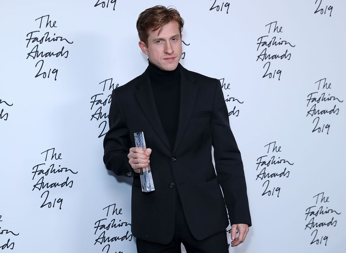 Bottega Veneta Creative director Daniel Lee poses after the company won the Brand of the Year award, following their award presentation at The Fashion Awards 2019 in London on 2 December 2019. Photo: AFP