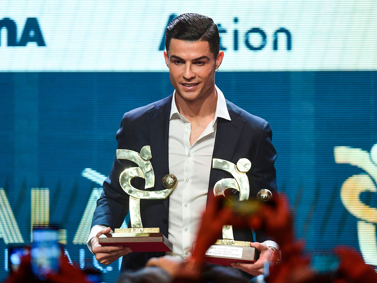 Juventus` Portuguese forward Cristiano Ronaldo receives the award of best player of the year of the Italian championship Serie A arrives to attend the `Gran Gala del Calcio` awards ceremony, organised by the Italian Footballers` Association (AIC), on 2 December 2019, in Milan. Photo: AFP