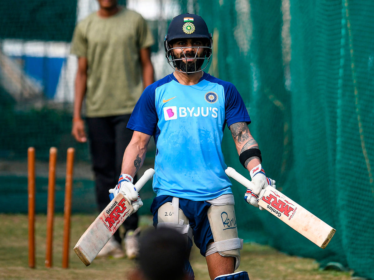 India`s captain Virat Kohli gestures as he holds two bats during a training session ahead of the first T20 international cricket match of a three-match series between India and West Indies at the Rajiv Gandhi International Cricket Stadium in Hyderabad on Wednesday.