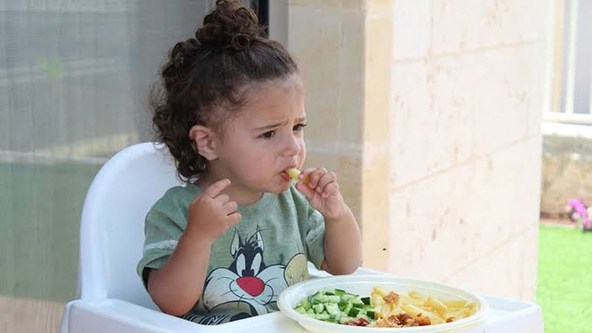 A child eats. Photo: Pixabay