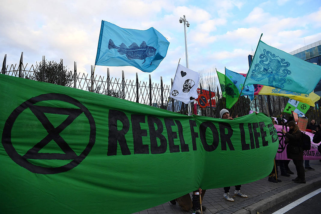 Global environmental movement Extinction Rebellion activists stage a welcome action for delegates attending the UN Climate Change Conference COP25 outside the `IFEMA - Feria de Madrid` exhibition centre, in Madrid, on 2 December 2019. Photo: AFP