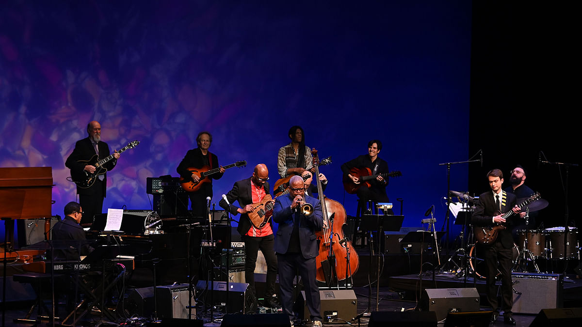 Trumpetist Terence Blanchard (C) performs with (from L-R) pianist and keyboard player Herbie Hancock, guitarists John Scofield, Lee Ritenour, Lionel Loueke, Stanley Jordan, Chico Pinheiro and Evgeny Pobozhiy, winner of the Herbie Hancock Institute of Jazz 2019 International Guitar Competition during an All-Star Gala Concert at the Kennedy Center in Washington DC, on 3 December 2019. Photo: AFP