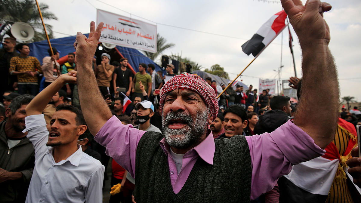 Iraqi demonstrators shout slogans as they take part in an anti-government demonstration in the capital Baghdad`s Tahrir Square, on 6 December 2019. Photo: AFP