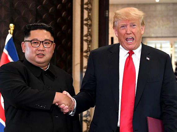 In this file photo taken on 12 June 2018, US president Donald Trump (R) and North Korea`s leader Kim Jong Un. Photo: AFP