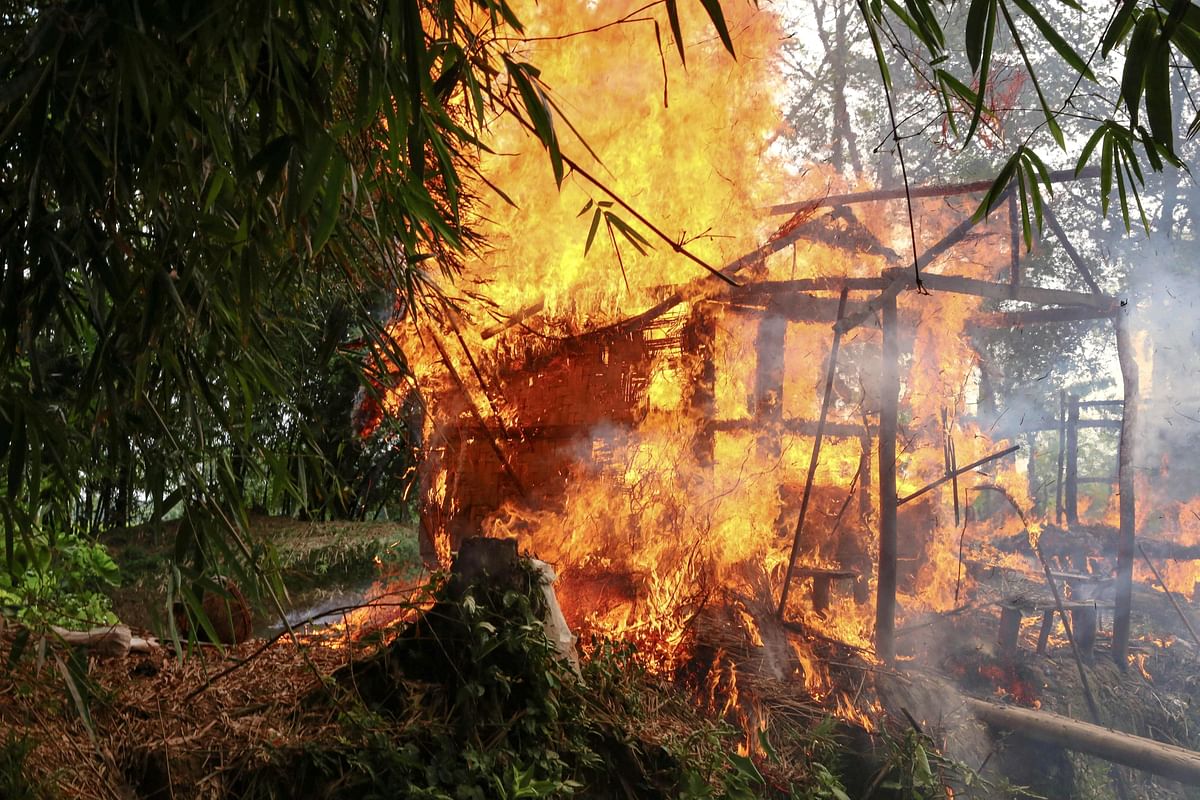 In this file photo taken on 7 September 2017, a house burns in Gawdu Tharya village near Maungdaw in Rakhine state in northern Myanmar. Photo: AFP