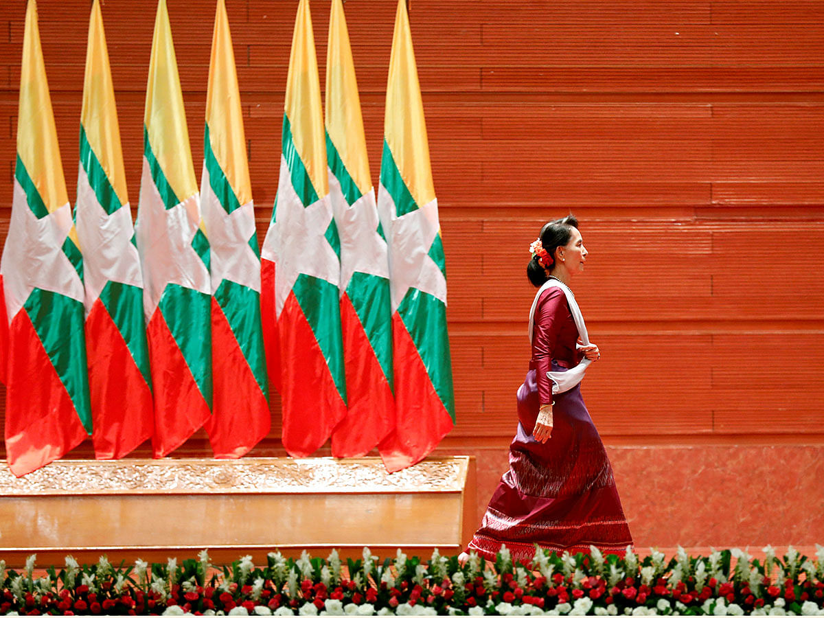 Myanmar State Counselor Aung San Suu Kyi walks off the stage after delivering a speech to the nation on the Rakhine and Rohingya situation, in Naypyitaw, Myanmar on 19 September 2017. Reuters File Photo