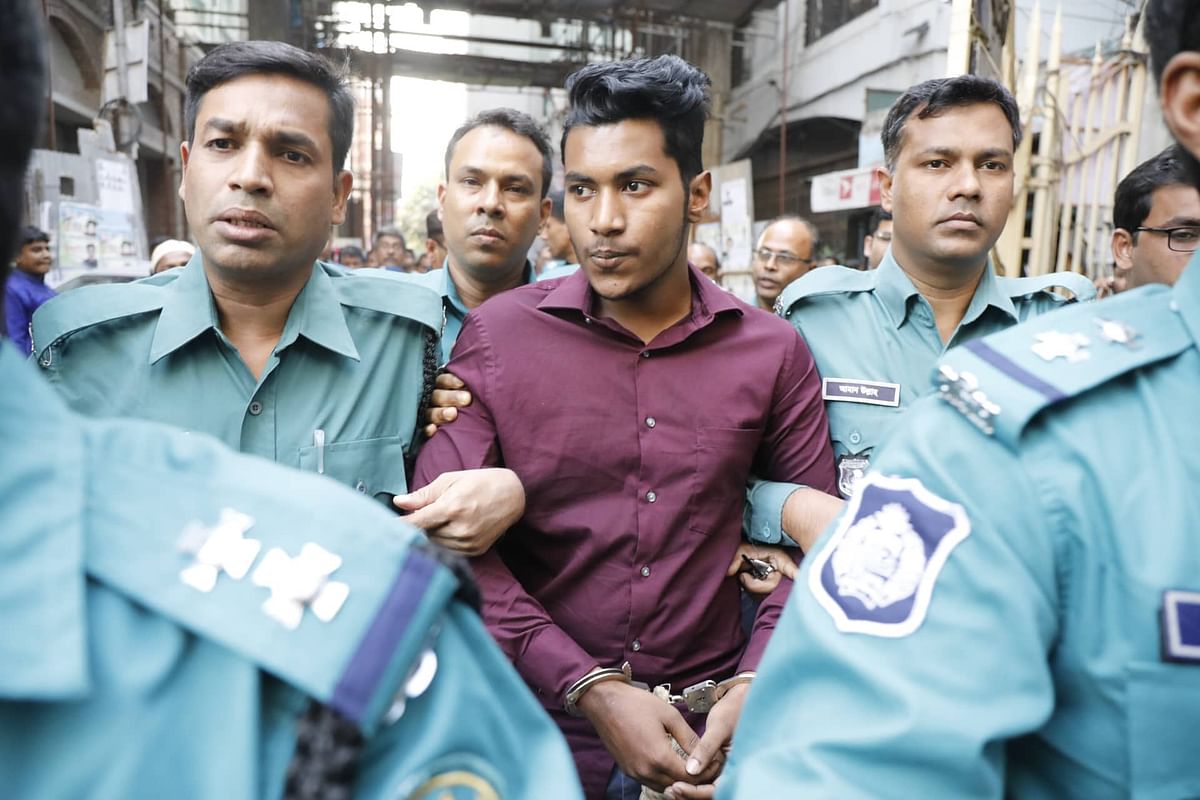 Abdur Rahman Saikat is produced before the court after he was detained in connection with the death of Stamford University student Rubaiyat Sharmin Rumpa. The photo is taken from the chief metropolitan magistrate court on 8 December. Photo: Dipu Malakar