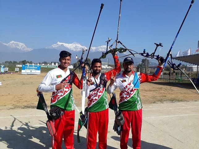 Three archers of Bangladesh -- Ruman Shana, Tamimul ISlam and Hakim Ahmed Rubel -- after winning the gold medal in Recurve team final beating Sri Lanka in 13th South Asian Games at Pokhara Stadium, Nepal on Sunday. Photo: Bodiuzzaman