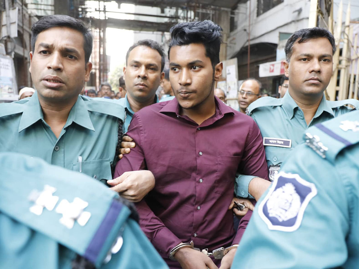 Abdur Rahman Saikat is produced before the court after he was detained in connection with the death of Stamford University student Rubaiyat Sharmin Rumpa. The photo is taken from the chief metropolitan magistrate court on 8 December. Photo: Dipu Malakar