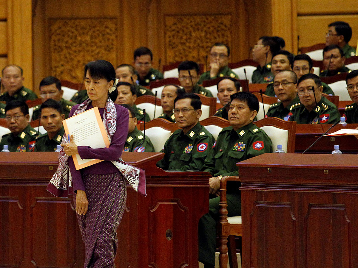 Pro-democracy leader Aung San Suu Kyi walks to take an oath at the lower house of parliament in Naypyitaw, Myanmar on 2 May 2012. Reuters File Photo