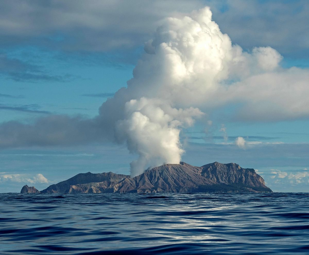This handout photo taken on 23 July 2019 and released to AFP courtesy of Chris Firkin on 9 December 2019 shows the volcano on New Zealand`s White Island spewing steam and ash. About 100 tourists were `on or around` New Zealand`s White Island volcano when it erupted on 9 December 2019 and an unknown number are unaccounted for, the country`s prime minister said. Photo: AFP