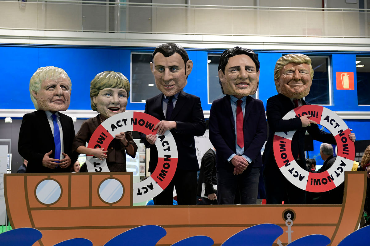 Five actors sporting bigheaded caricatures depicting (L to R) British Prime Minister Boris Johnson, German Chancellor Angela Merkel, French President Emmanuel Macron, Canadian Prime Minster Justin Trudeau and US President Donald Trump perform during the `Oxfam Big Heads` event within the UN Climate Change Conference COP25 at the `IFEMA - Feria de Madrid` exhibition centre, in Madrid, on 10 December 2019. Photo: AFP