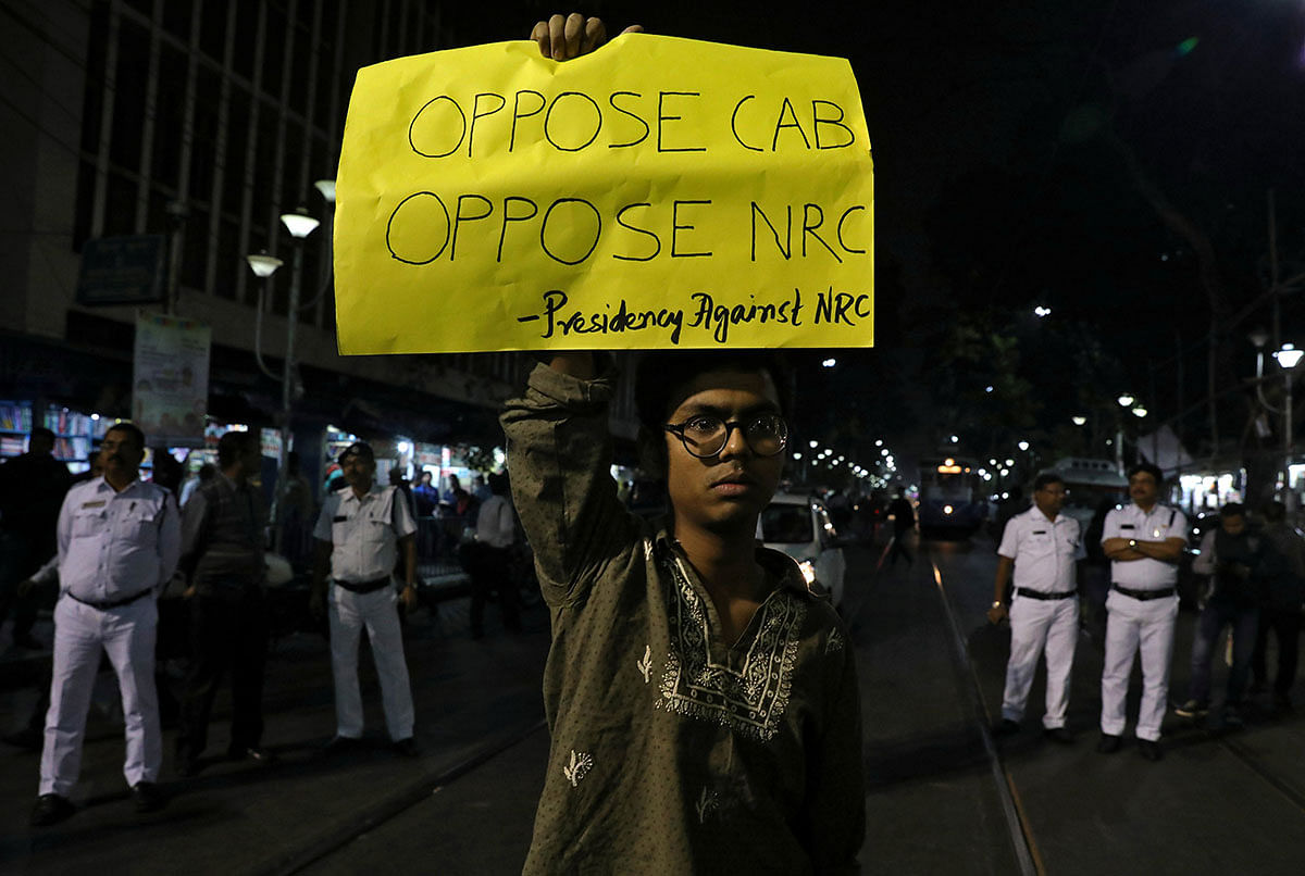 A student displays a placard during a protest against the National Register of Citizens (NRC) and the Citizenship Amendment Bill (CAB), a bill that seeks to give citizenship to religious minorities persecuted in neighbouring Muslim countries, in Kolkata, India, on 10 December 2019. Photo: Reuters