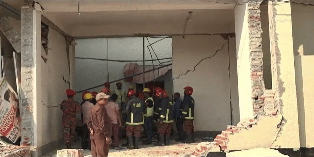 Fire service men inspect a room of a sweater factory in Ashulia, on the outskirts of Dhaka, after it was damaged following a gas heater machine blast in the factory on 10 December 2019. Photo: UNB
