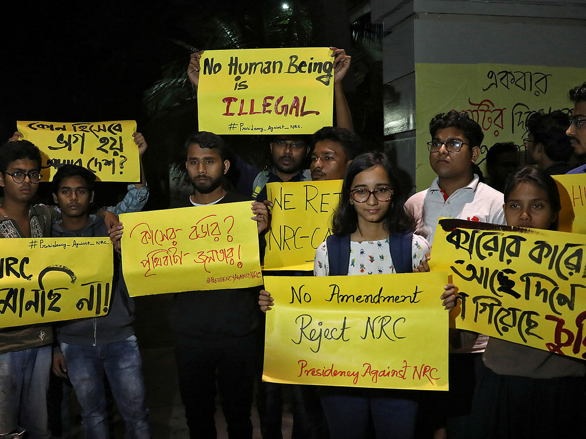 Students display placards as they attend a protest against the National Register of Citizens (NRC) and the Citizenship Amendment Bill (CAB), a bill that seeks to give citizenship to religious minorities persecuted in neighbouring Muslim countries, in Kolkata, India, on 10 December 2019. Photo: Reuters