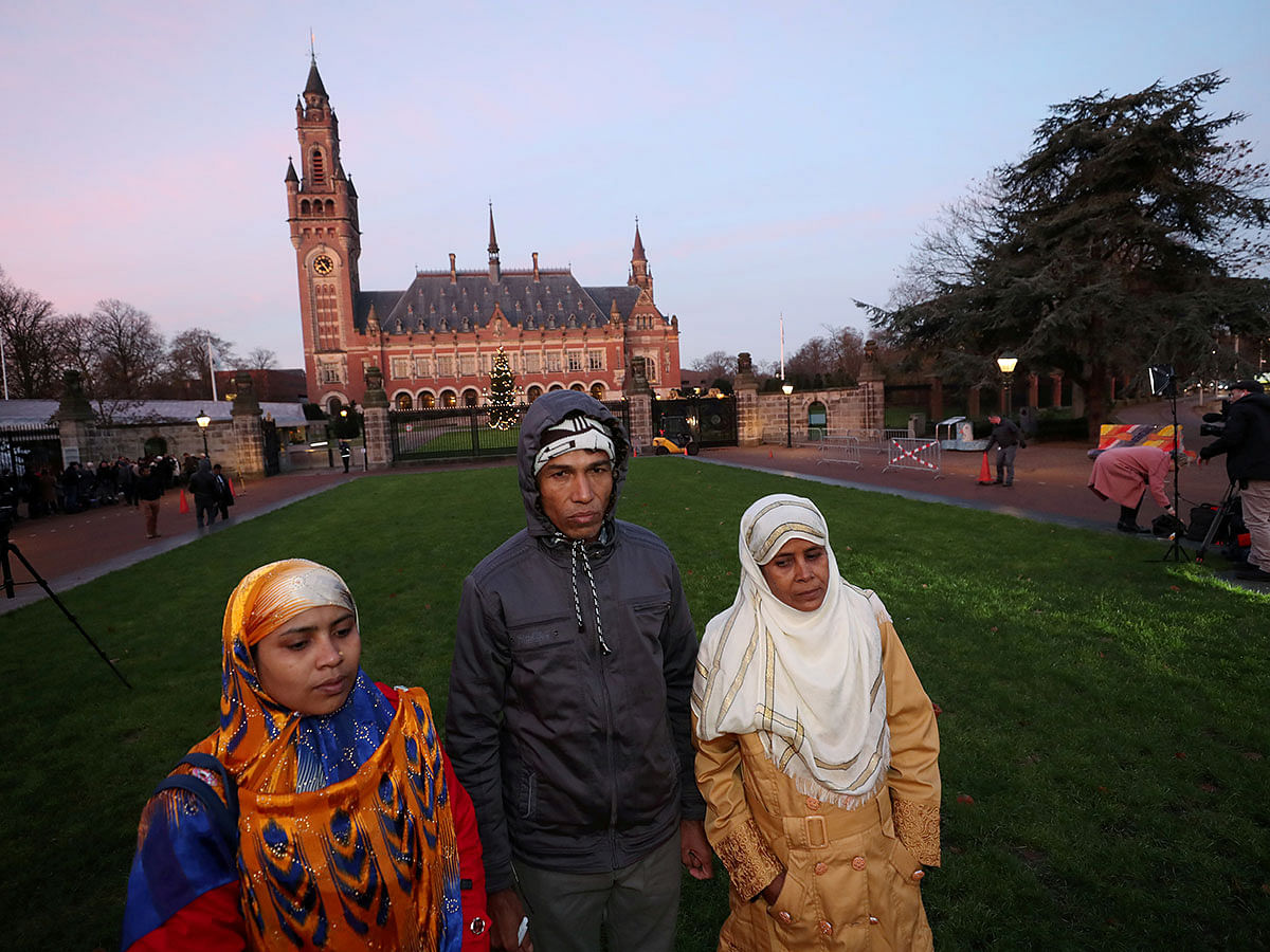 Rohingya survivors stand outside the International Court of Justice (ICJ), ahead of hearings in a case filed by Gambia against Myanmar alleging genocide against the minority Muslim Rohingya population, in The Hague, Netherlands on 10 December 2019. Photo: Reuters