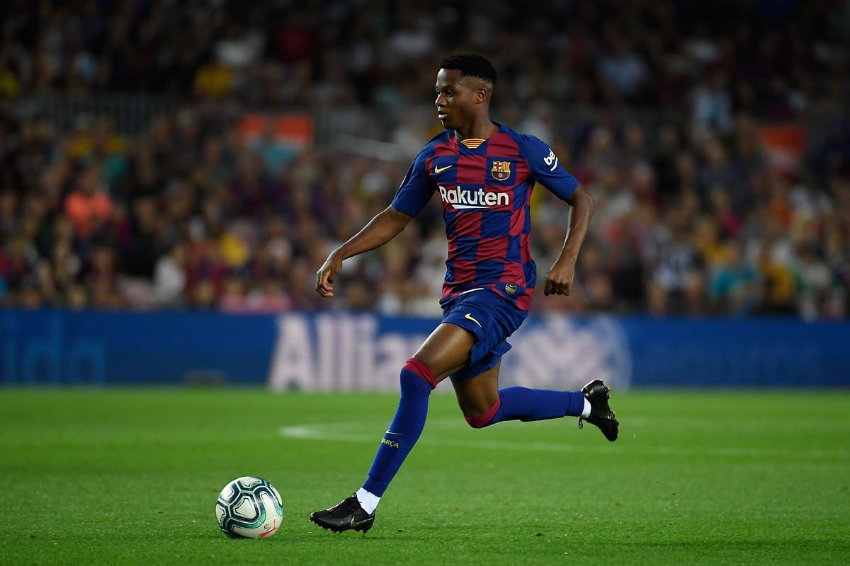 In this file photo taken on 24 September 2019 Barcelona´s Guinea-Bissau forward Ansu Fati runs with the ball during the Spanish league football match between FC Barcelona and Villarreal CF at the Camp Nou stadium in Barcelona, on 24 September 2019. Photo: AFP