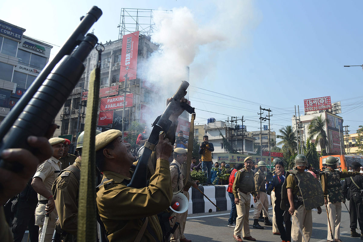 Police personnel fire tear gas to disperse the students protesting against the governments Citizenship Amendment Bill (CAB), in Guwahati on December 11, 2019. Photo: AFP