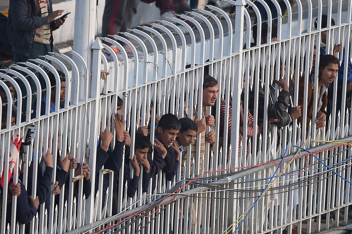 Spectators watch the play during the first day of the first Test cricket match between Pakistan and Sri Lanka at the Rawalpindi Cricket Stadium in Rawalpindi on 11 December, 2019. Photo: AFP