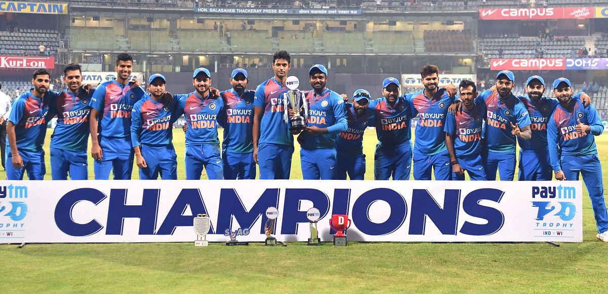 Indian cricket team pose with trophy after winning a three-match series between India and West Indies at the Wankhede Stadium in Mumbai, on 11 December 2019. Photo: AFP