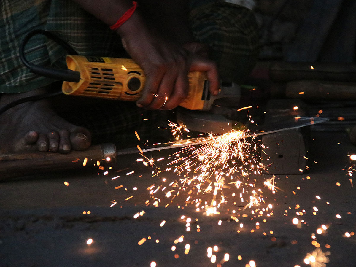 A worker wields a metal work in Rajbari, Khagrachhari on 11 December 2019. Photo: Nerob Chowdhury