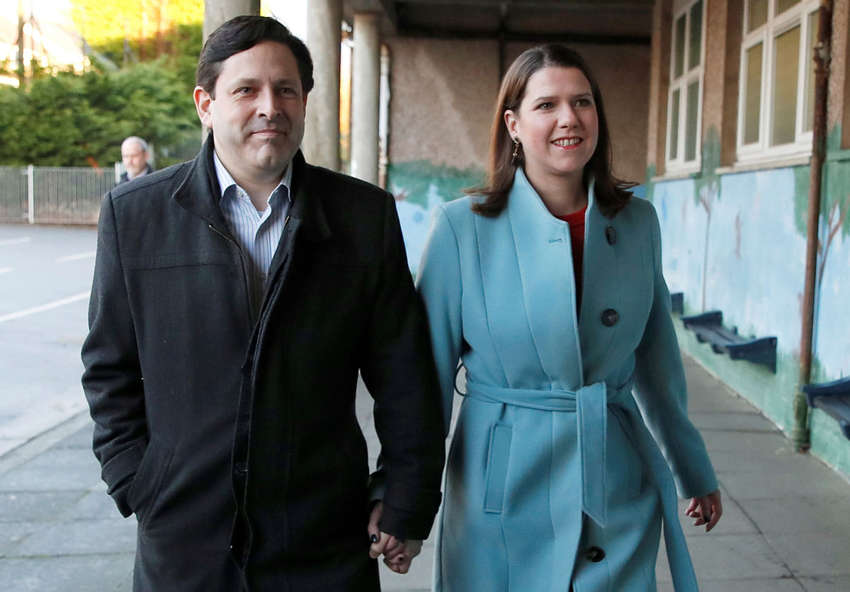 Liberal Democrats leader Jo Swinson and her husband Duncan Hames arrive at a polling station to vote in the general election in Glasgow, Britain, December 12, 2019. Photo: Reuters