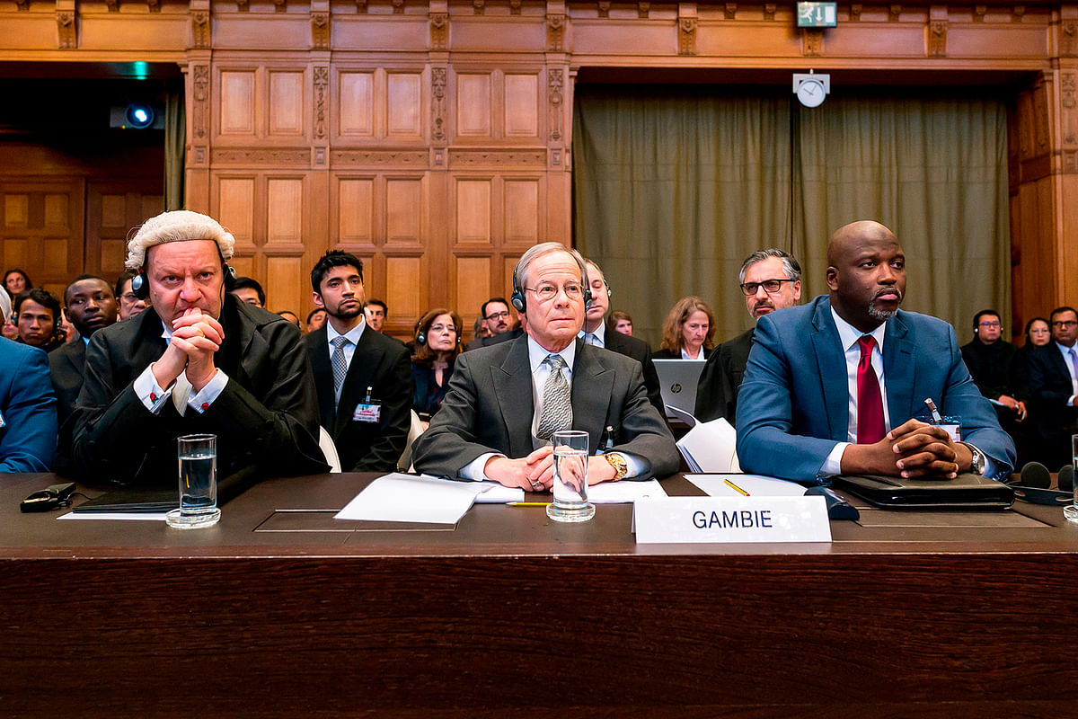 A handout photo released on 10 December 2019 by the International Court of Justice shows the Gambian delegation led by Gambian politician and lawyer Abubacarr Marie Tambadou a.k.a Ba Tambadou (R) attending the start of a three-day hearing on the Rohingya genocide case before the UN International Court of Justice at the Peace Palace of The Hague. Photo: AFP