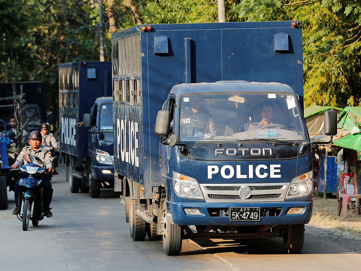 Police vehicles transport Rohingya Muslims charged with travelling illegally to a court hearing in Pathein, Ayeyarwady, Myanmar, on 11 December 2019. Photo: Reuters