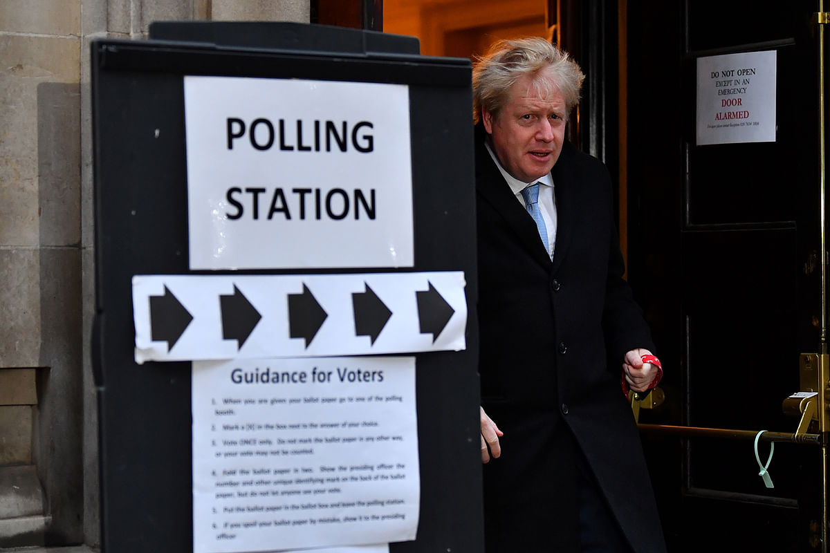 Britain`s Prime Minister Boris Johnson leaves a polling station at the Methodist Central Hall, with his dog Dilyn, after voting in the general election in London, Britain, 12 December, 2019. Photo: Reuters