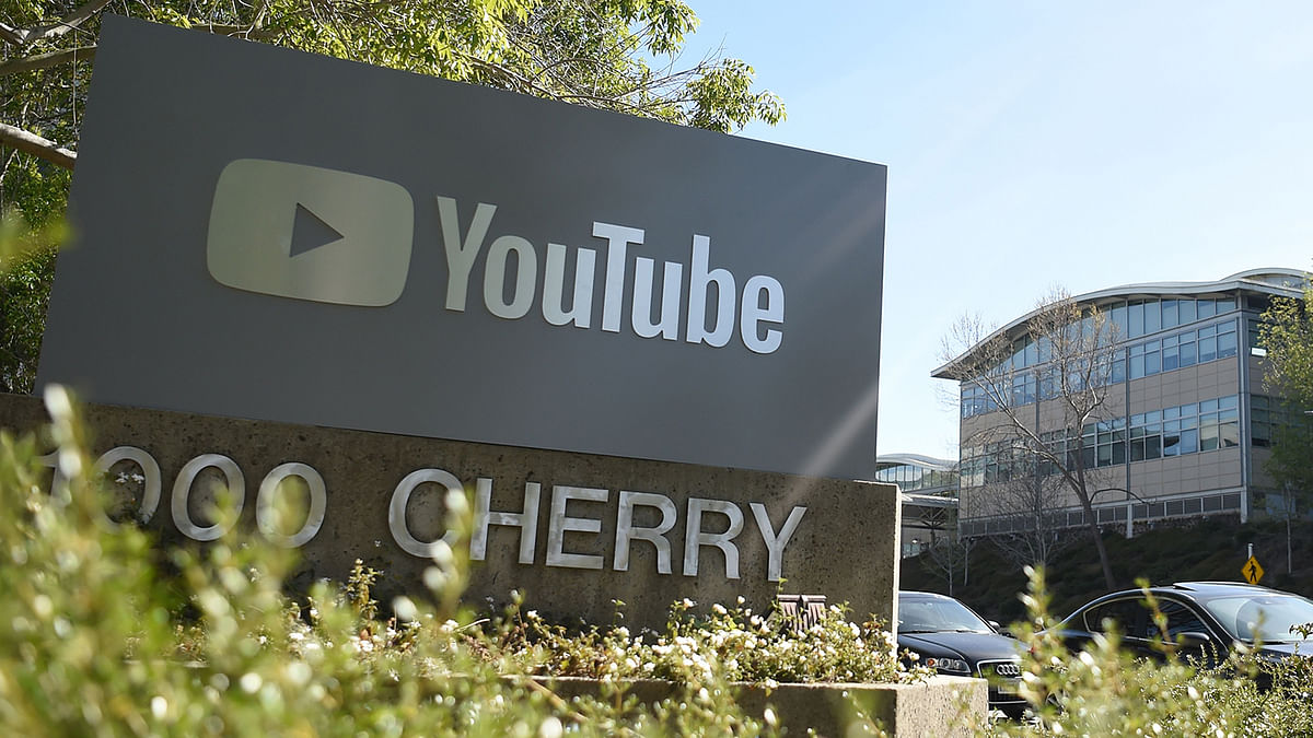 In this file photo taken on 3 April 2018, a YouTube sign is seen at YouTube`s corporate headquarters in San Bruno, California. Photo: AFP