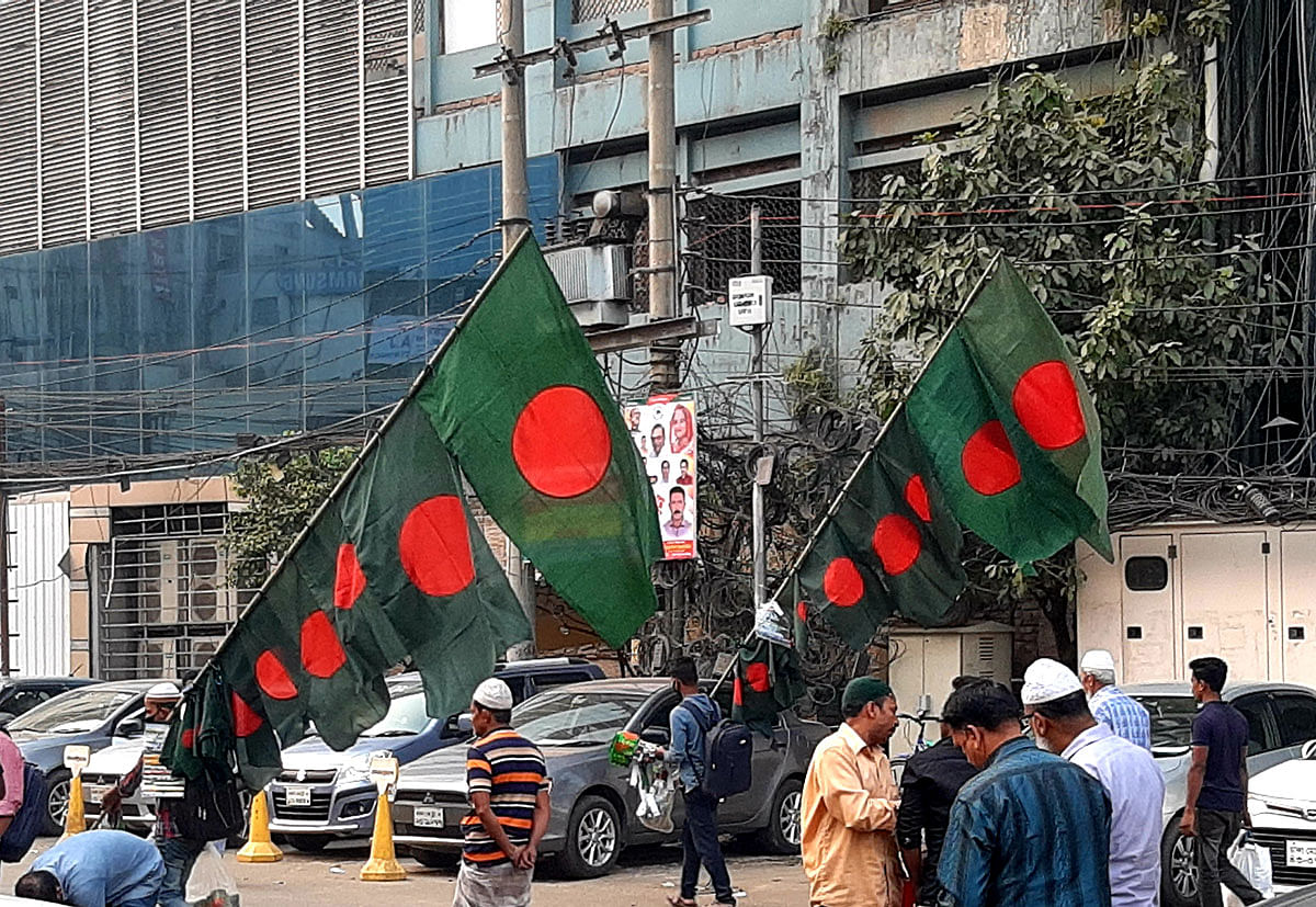 Vendors sell Bangladesh flags ahead of the Independence Day in Karwanbazar in the capital on 11 December 2019. Photo: Mansura Hossain