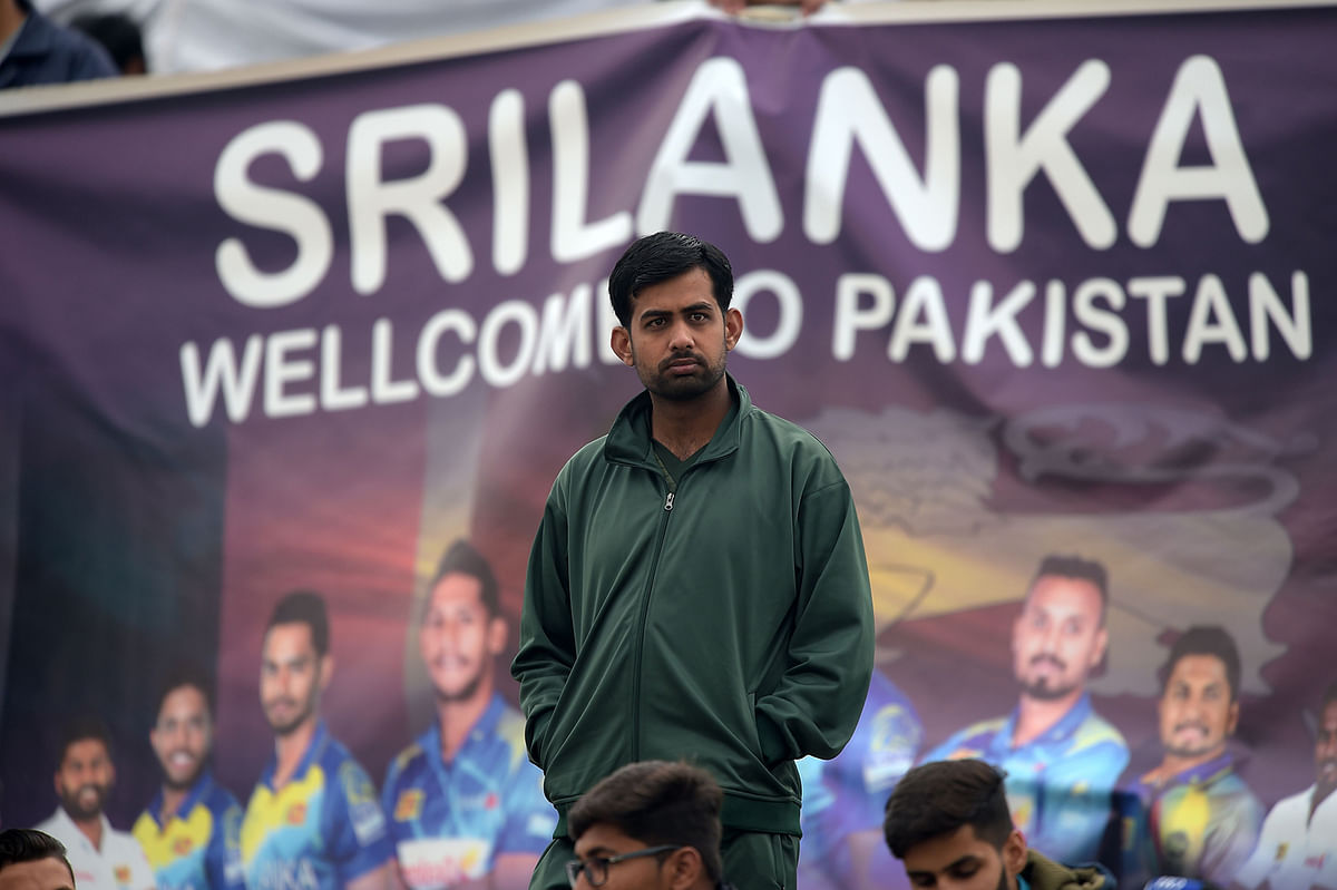 A spectator looks on during the third day of the first Test cricket match between Pakistan and Sri Lanka at the Rawalpindi Cricket Stadium in Rawalpindi on 13 December, 2019. Photo: AFP