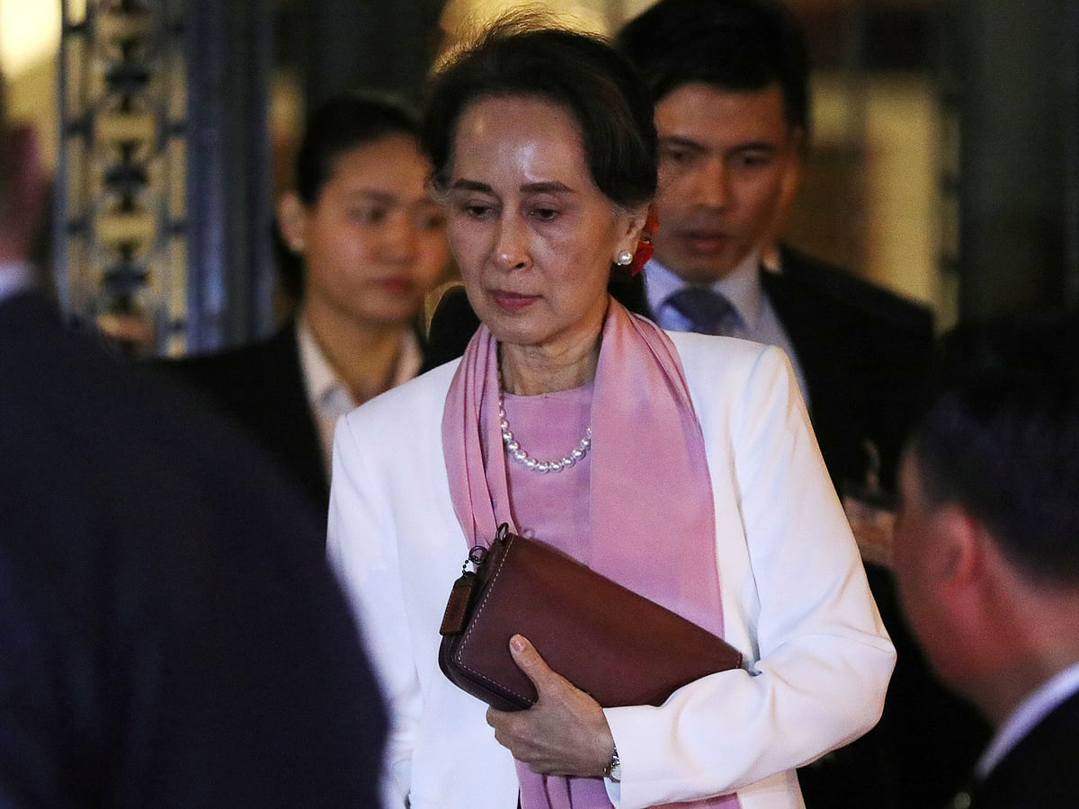 Myanmar`s leader Aung San Suu Kyi leaves the International Court of Justice (ICJ), the top United Nations court, after court hearings in a case filed by Gambia against Myanmar alleging genocide against the minority Muslim Rohingya population, in The Hague on 12 December, 2019. Photo: Reuters