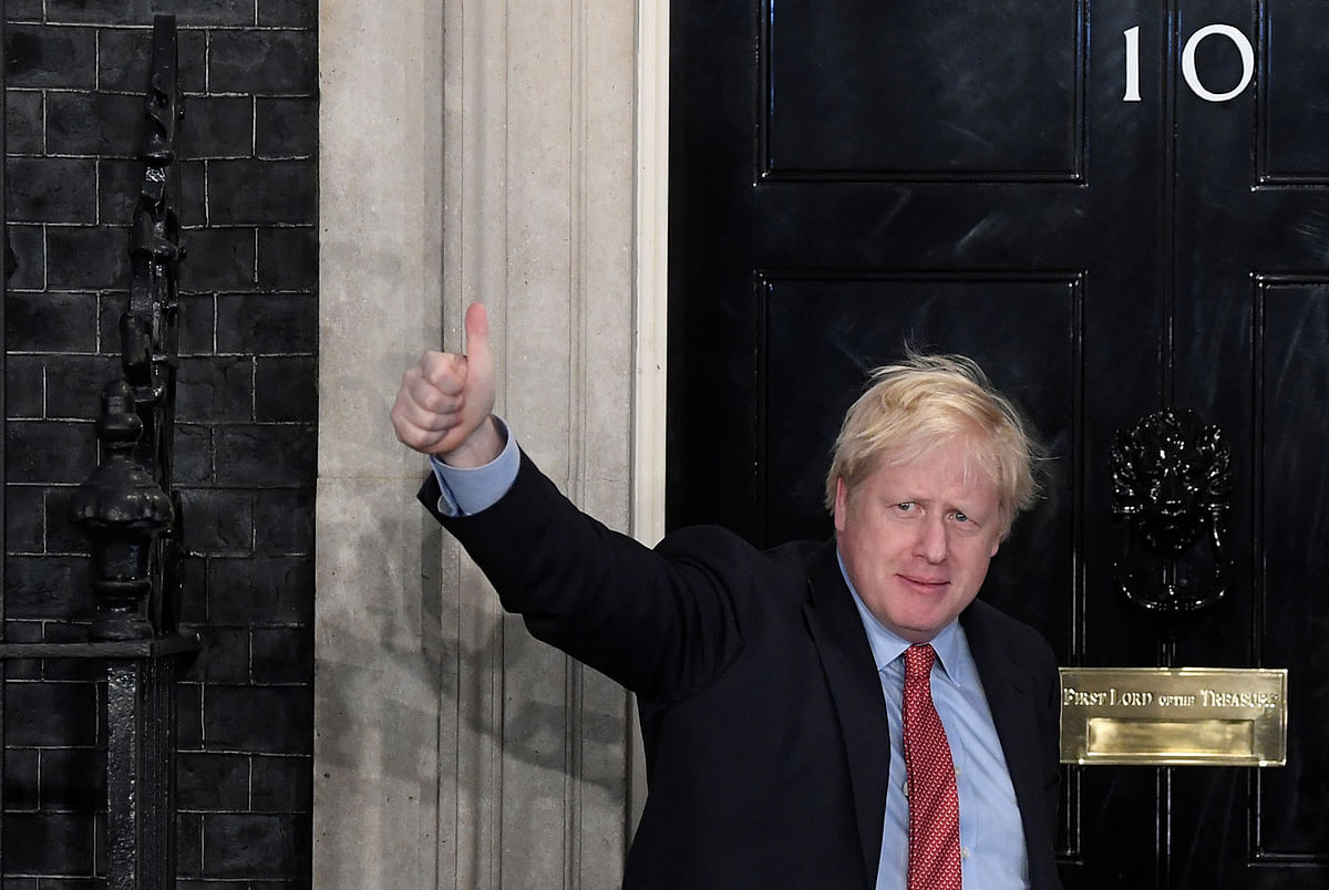 Britain`s Prime Minister Boris Johnson gestures as he arrives at 10 Downing Street on the morning after the general election in London, Britain, 13 December, 2019. Photo: Reuters