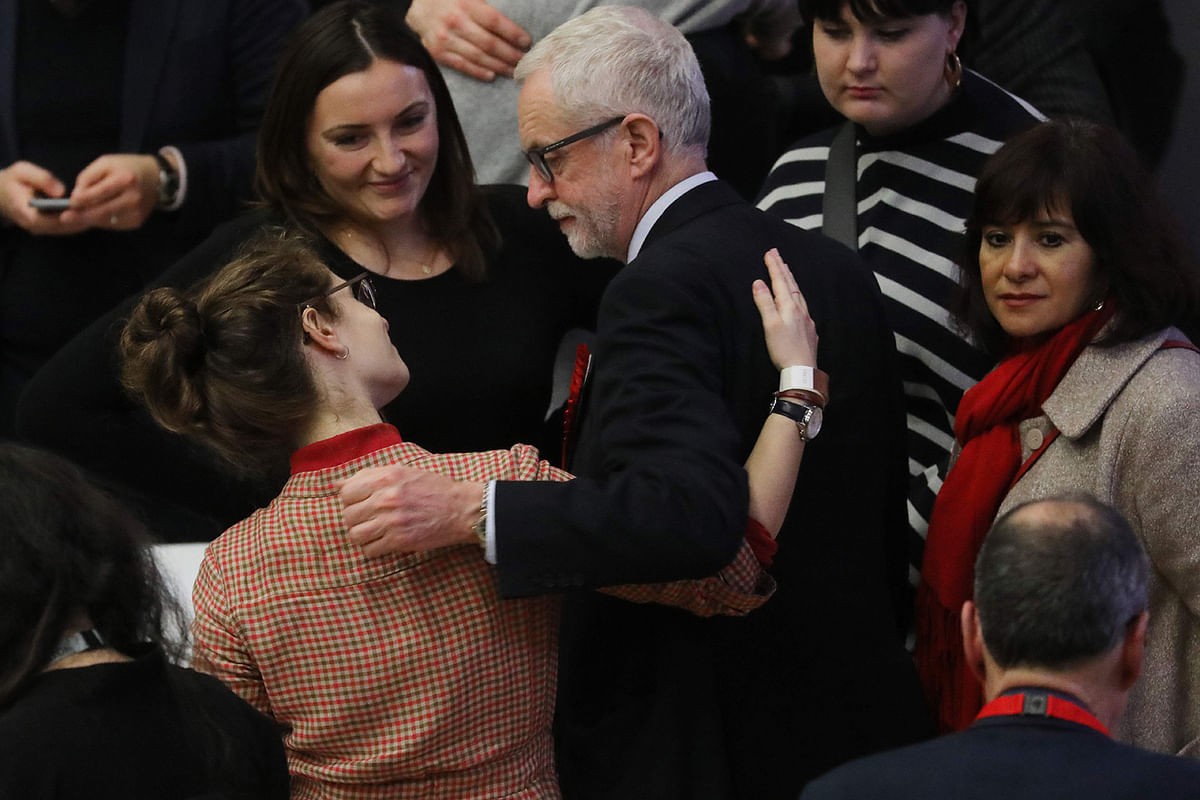 Britain`s opposition Labour Party leader Jeremy Corbyn (C) greets party agents and activists as he arrives at the count centre in Islington, north London, on 13 December, 2019 to hear the results of the Islington North constituency race as part of the UK general election. Photo: AFP