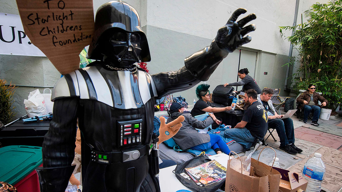 Star Wars fans wait outside the TCL Chinese Theater one week before the release of `Star Wars: The Rise of Skywalker` movie in Hollywood, California on 12 December 2019. The new movie will be released on December 20 in the US and is the third installment of the Star Wars sequel trilogy. Photo: AFP