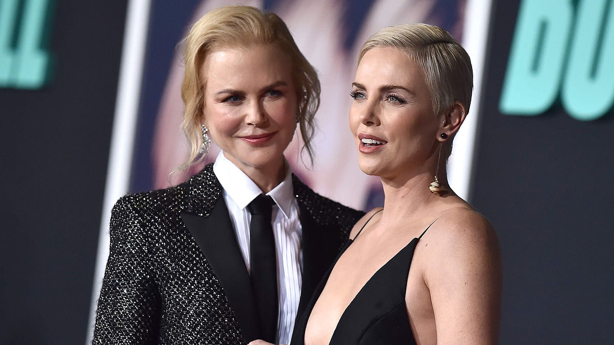 Australian actress Nicole Kidman (L) and South African actress Charlize Theron arrive for Lionsgate`s special screening of `Bombshell` at the Regency Village Theatre in Westwood, California on 10 December 2019. Photo: AFP