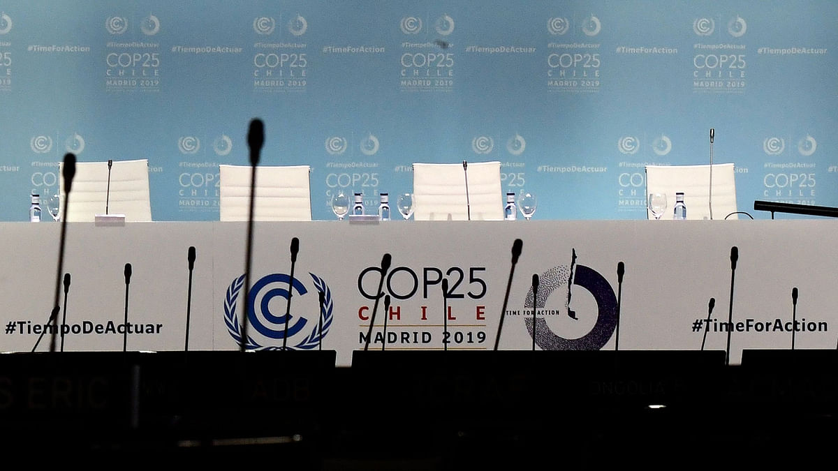 Empty chairs are pictured on the last day of the UN Climate Change Conference COP25 at the `IFEMA - Feria de Madrid` exhibition centre, in Madrid, on 13 December 2019. Photo: AFP