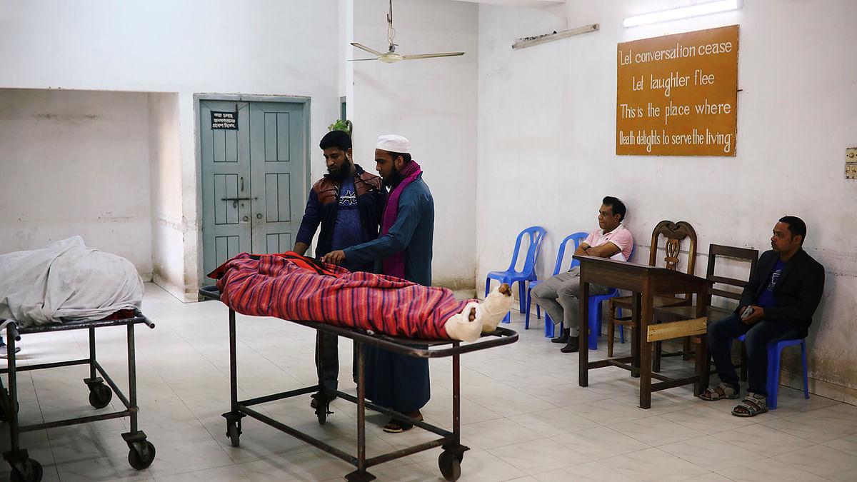 Relatives are seen at the morgue of Dhaka Medical College Hospital after a deadly fire in a plastic factory in Dhaka, Bangladesh on 12 December 2019. Photo: Reuters